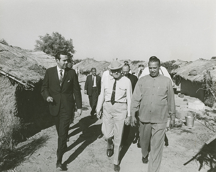 Photograph of the Congressional Delegation touring an Indian village<br /><br />
