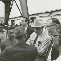 Photograph of Congressional Delegation at a a briefing at the Port of Madras<br /><br />
